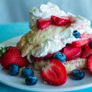 Pancakes Inspired by Strawberry Shortcake Topped with Fresh Berries and Whipped Cream