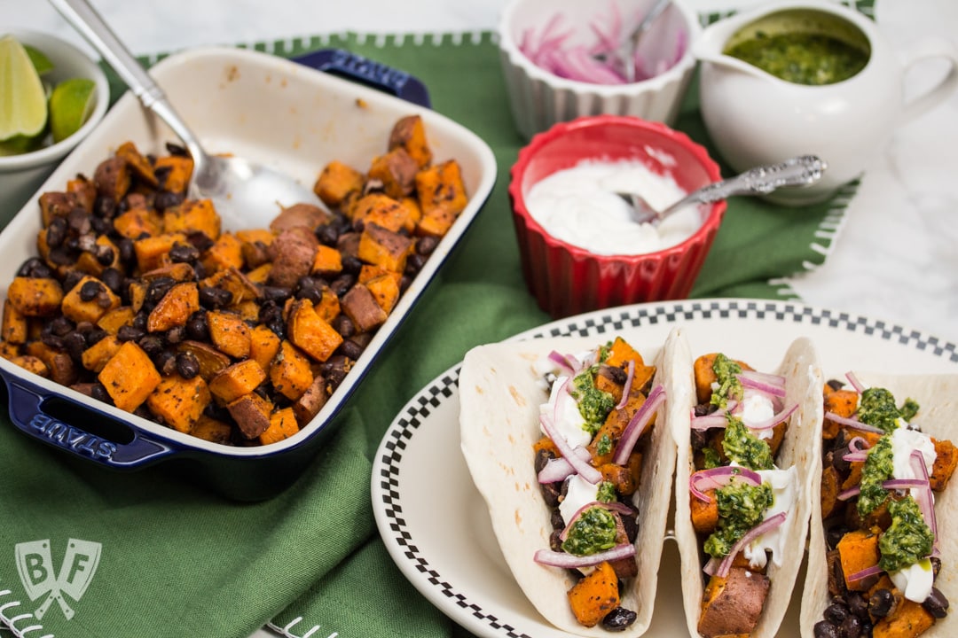 Tacos with Sweet Potatoes and Black Beans, Seasoned and Garnished with Fresh Ingredients