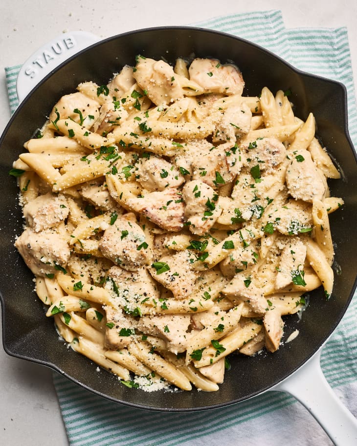 Creamy chicken Alfredo pasta on a skillet pan