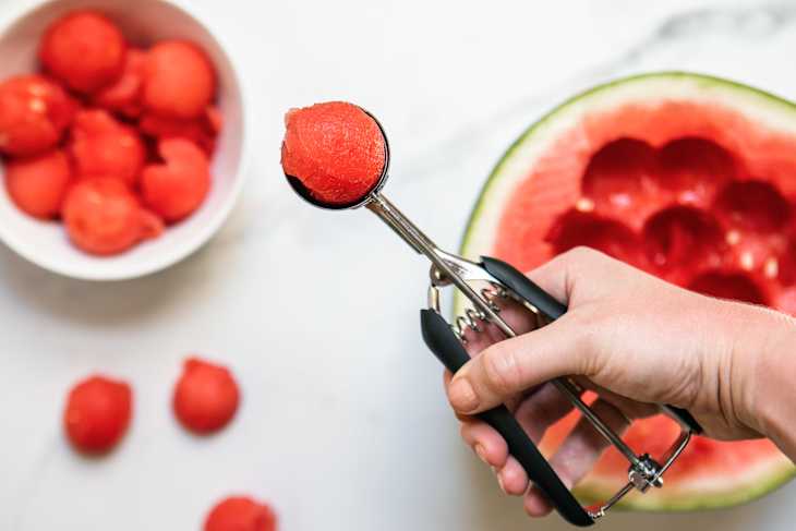 Using an OXO scooper to make watermelon balls