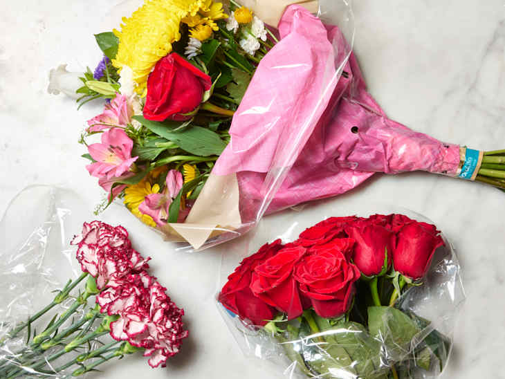 An overhead view of three Trader Joe's bouquets of flowers