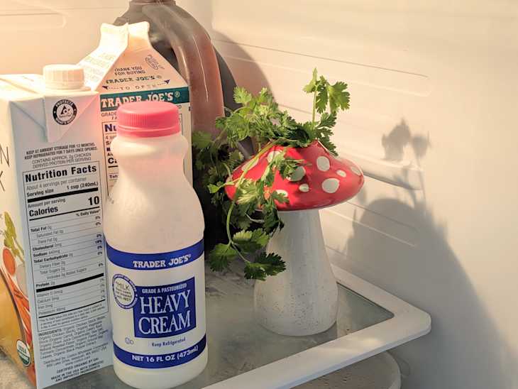 Herbs stored in mushroom vase in refrigerator.