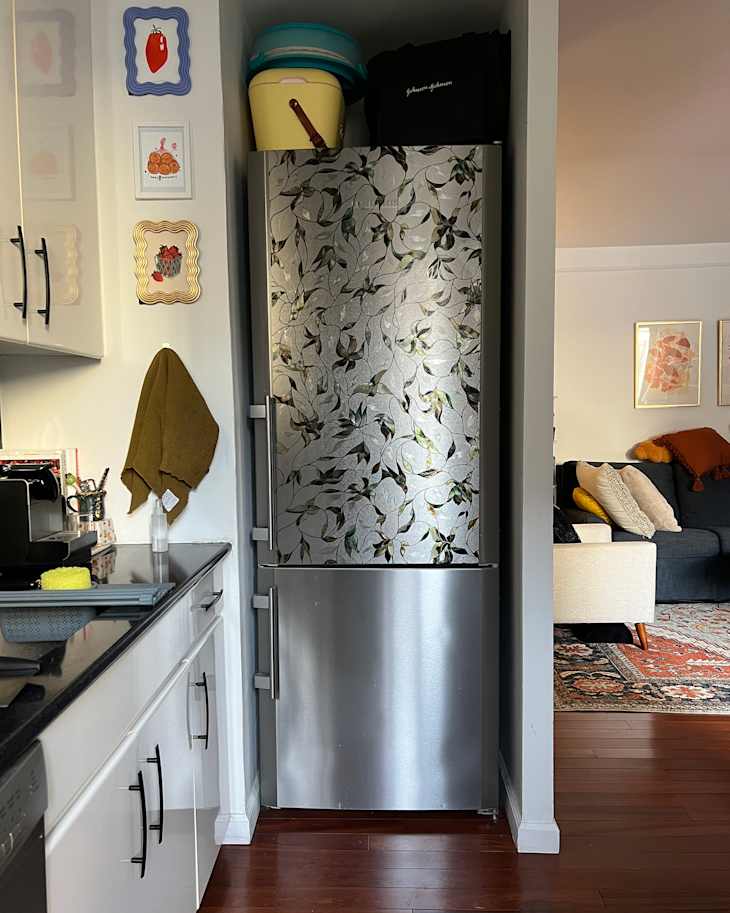 Window film being placed on refrigerator.