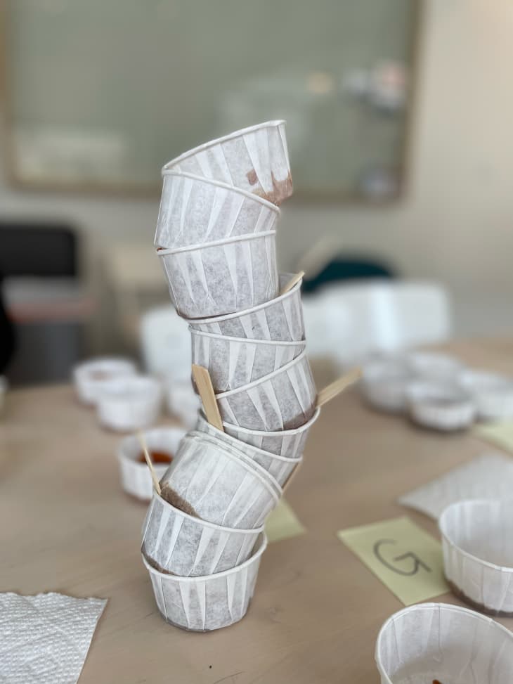 Stack of paper ramekins for bbq sauce taste test.
