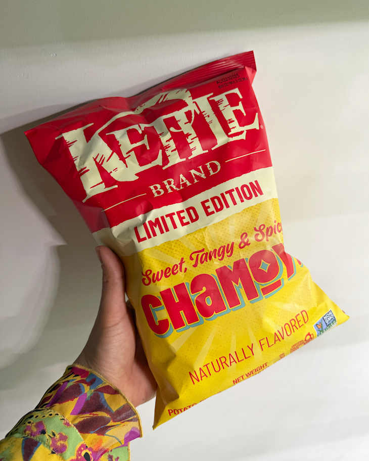 someone golding a bag of Kettle brand Limited Edition Chamoy chips