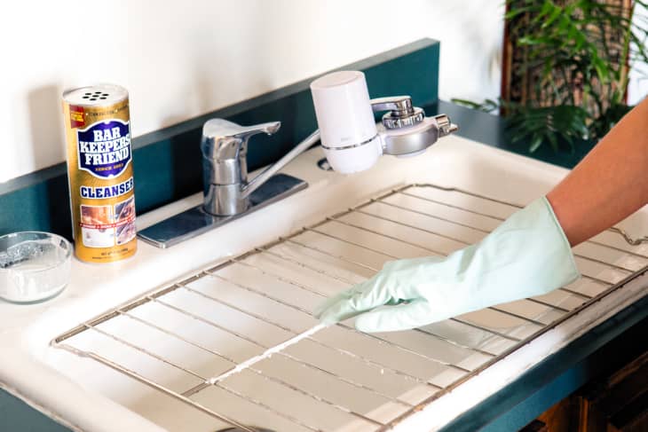 Scrubbing oven rack with Bar Keepers Friend