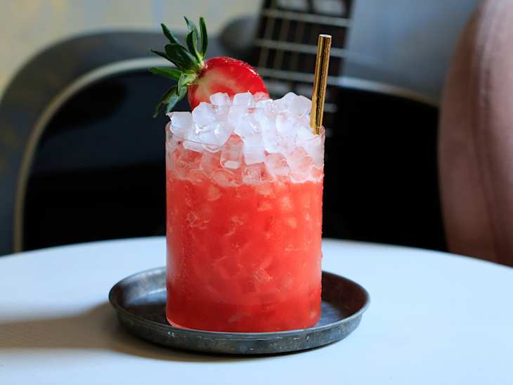Tropical cocktail on nugget or pebble ice served in a rocks glass.