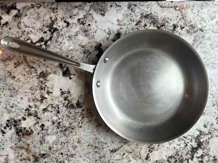 Stainless steel pan on countertop.