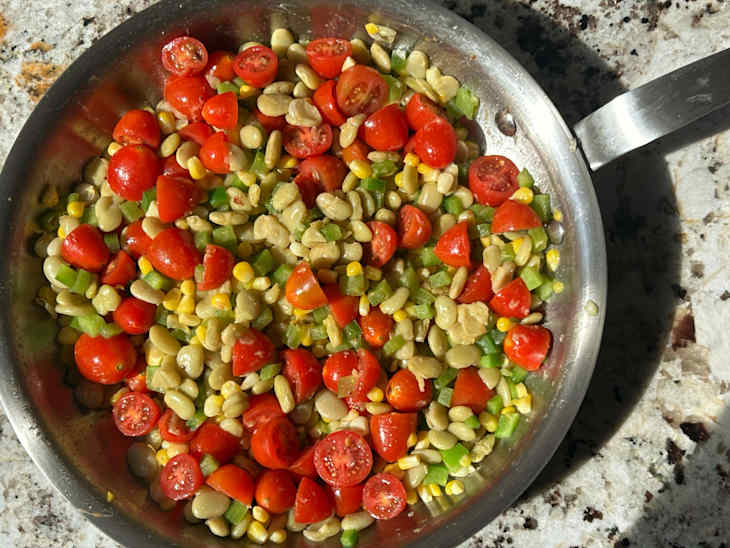 Summer vegetables cooking in skillet.