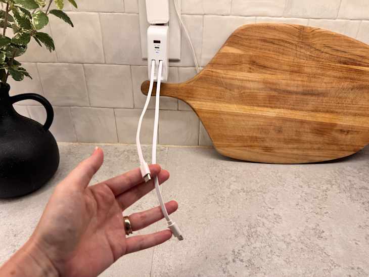 Cords coming out of retractable cord charger.