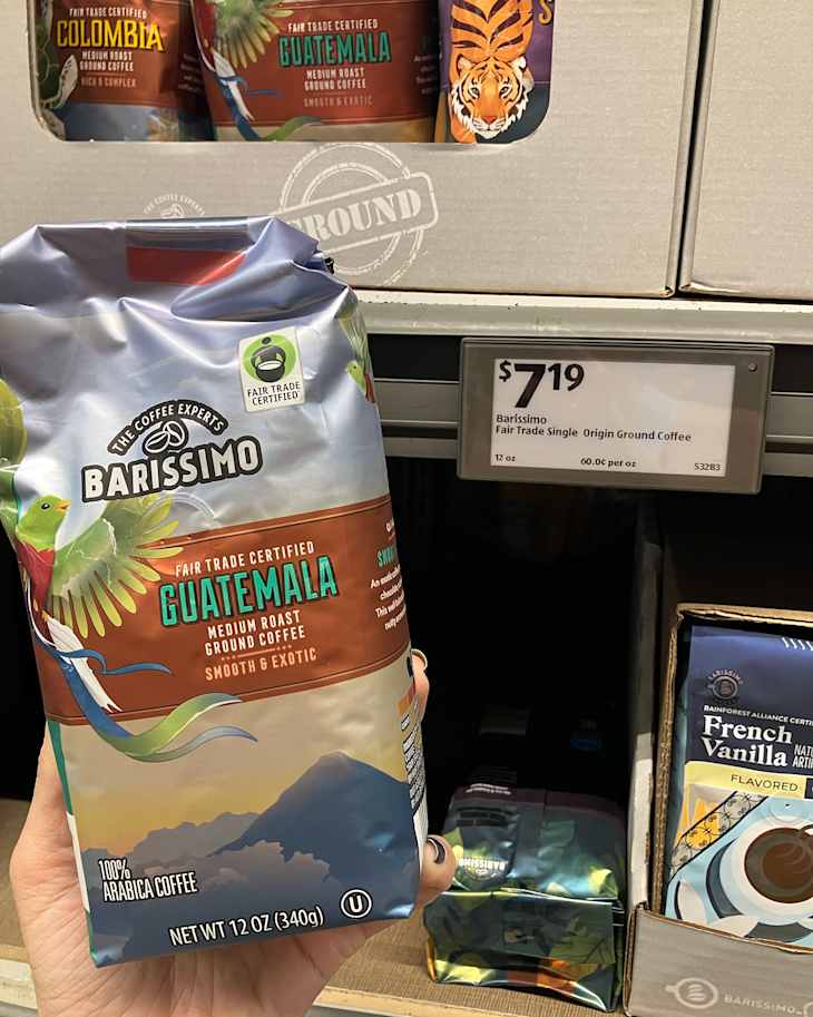 Someone holding bag of Guatemalan coffee.