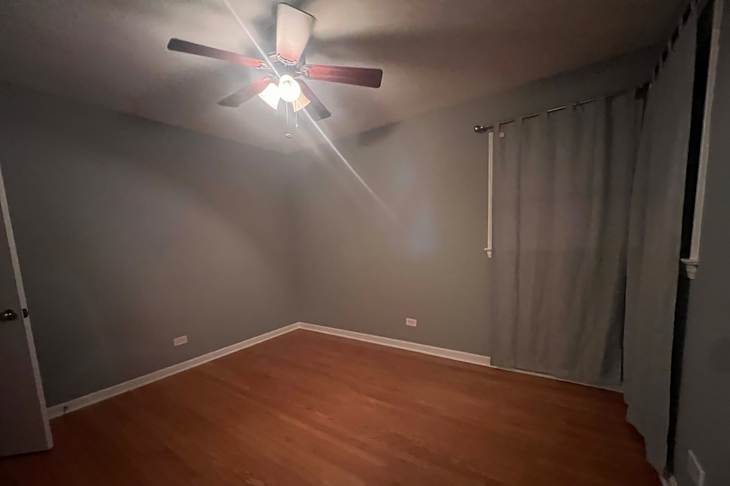 Dark bedroom before being staged.
