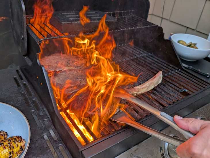 Steaks being grilled.