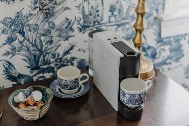 Coffee cup on nespresso machine.