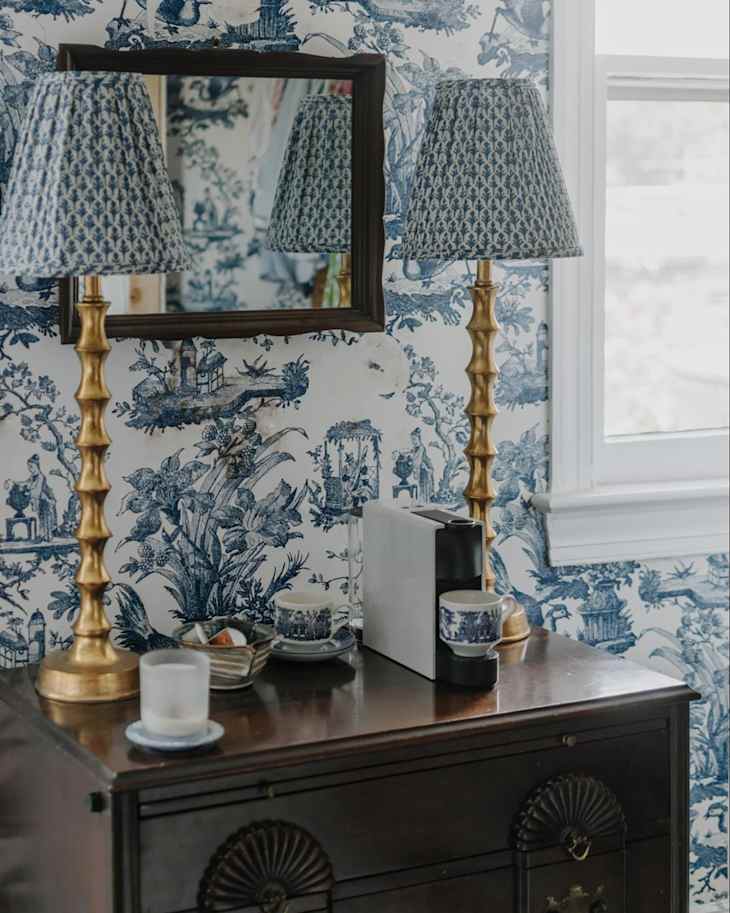 Nespresso machine on bedroom nightstand.