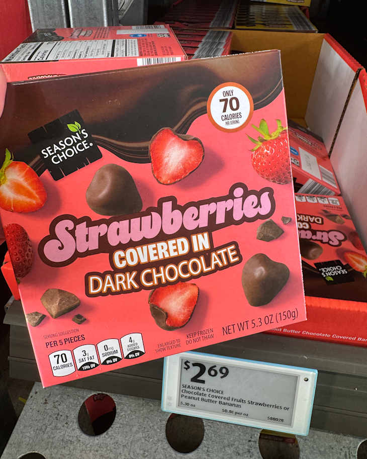 Box of strawberries covered in dark chocolate with a price tag of $2.69, featuring nutritional information and serving suggestions.