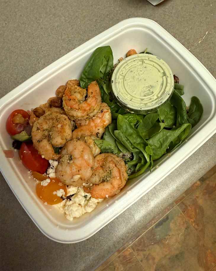 Shrimp and greens in Cook Unity tray.