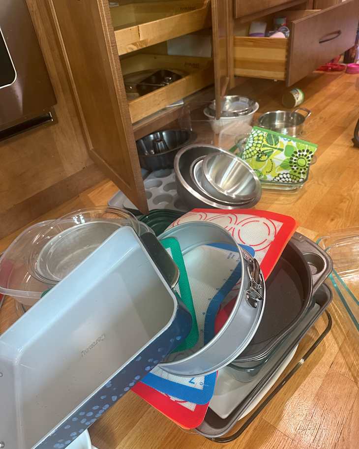 Kitchenware on floor during decluttering.