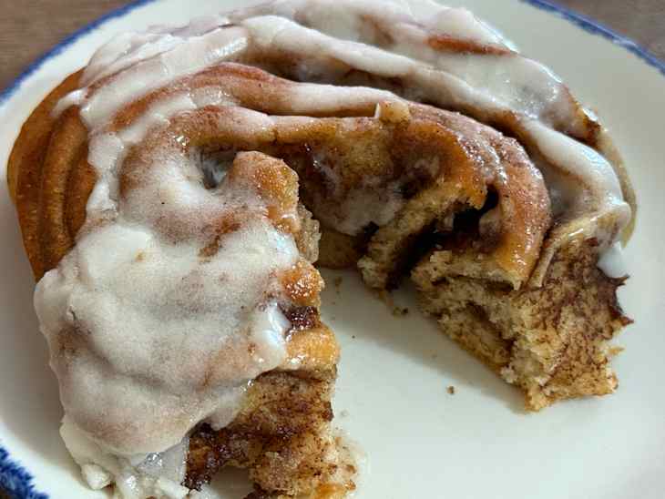 Slice taken out of Trader Joe's cinnamon roll .