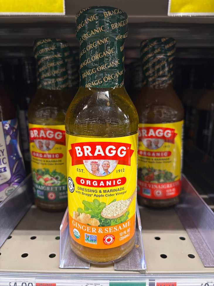 Organic Ginger & Sesame dressing in a clear bottle.