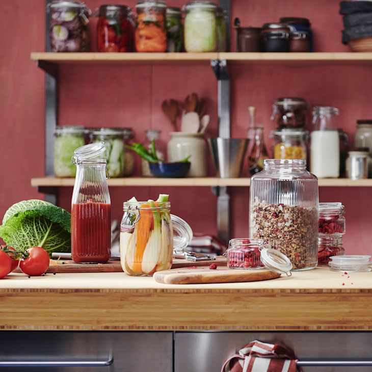 Kitchen countertop with various vintage vase styles.