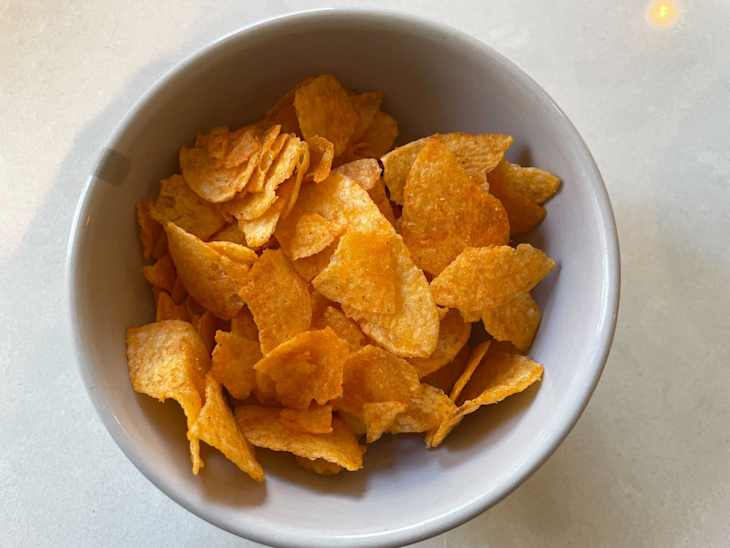 Lay's NFL Tailgating Potato Chips in bowl: Kettle Cooked Cheesy Buffalo Chicken Dip flavor