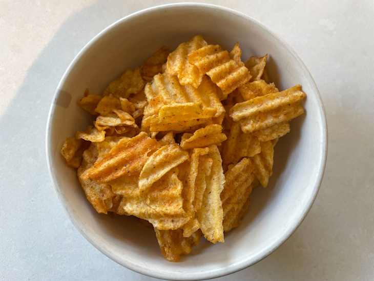 Lay's NFL Tailgating Potato Chips in bowl: Wavy loaded nachos flavor