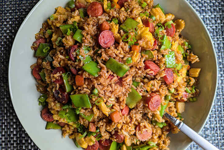 plate of hot dog fried rice with scallions