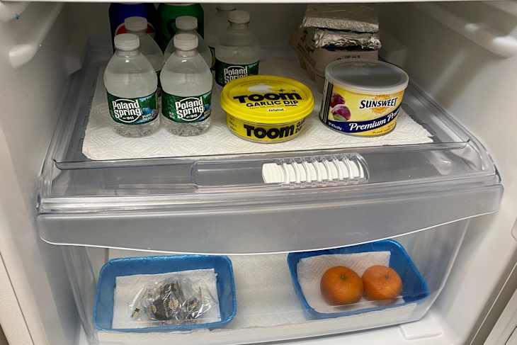 Produce organized in refrigerator drawer.