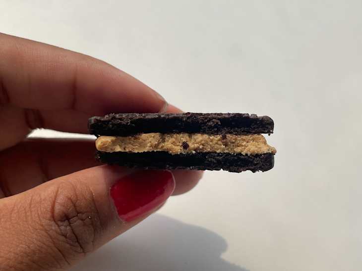 Bite taken out of Reese's oreo cookie.