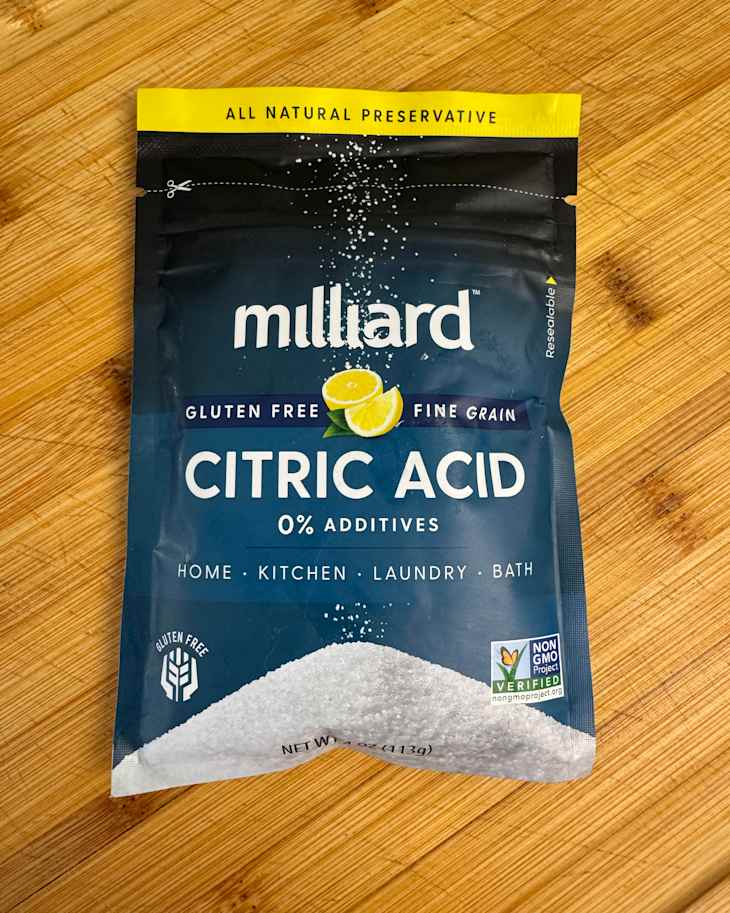 Package of Milliard citric acid powder on countertop.