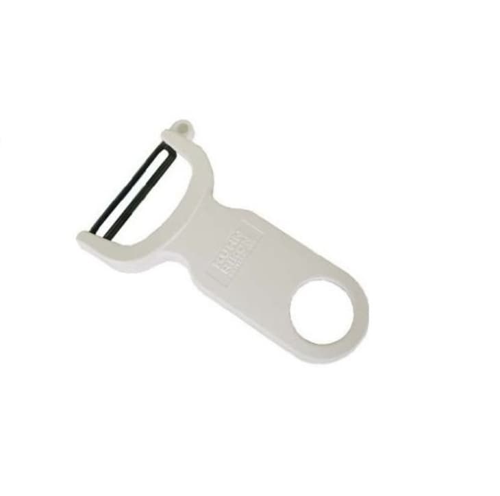 White vegetable peeler with a black blade and circular handle.
