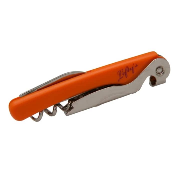 Orange corkscrew with a metal bottle opener and foil cutter, featuring "Lefty's" text on the handle.