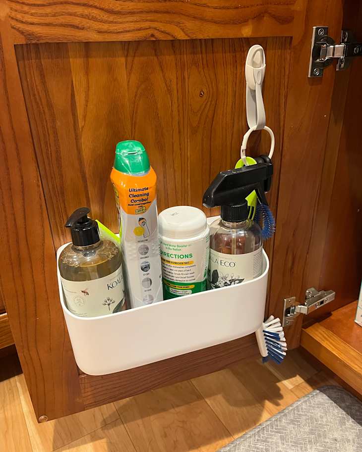 Command organizing caddy on inside of kitchen door.