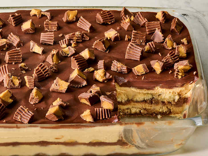 Chocolate peanut butter tiramisu topped with chopped chocolate candies.
