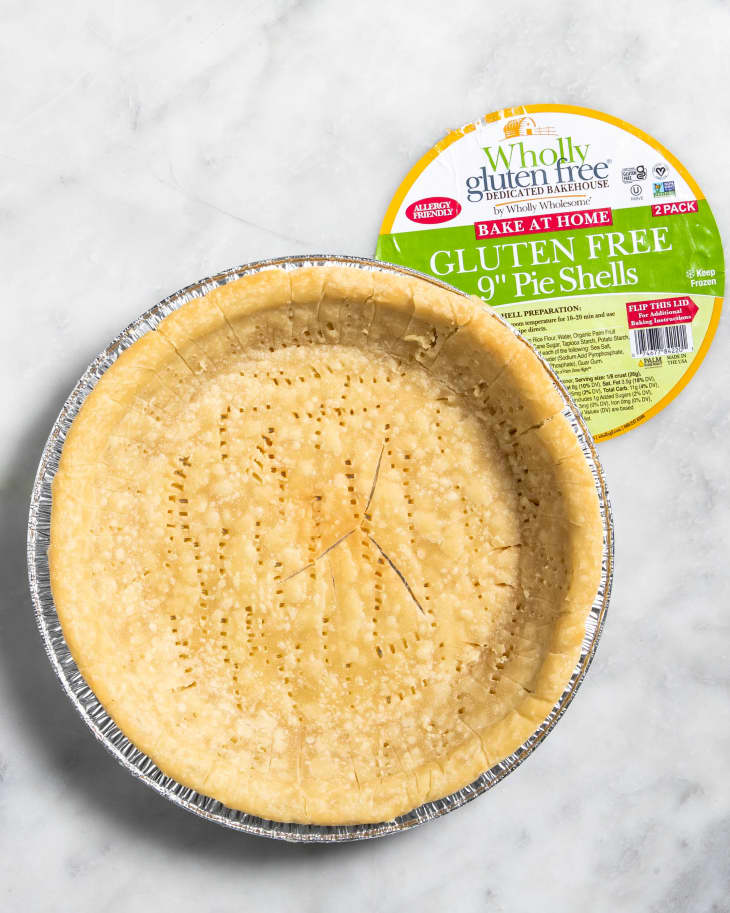 Overhead view of a baked, plain, Wholy
wholesome gluten free brand frozen pie crust.