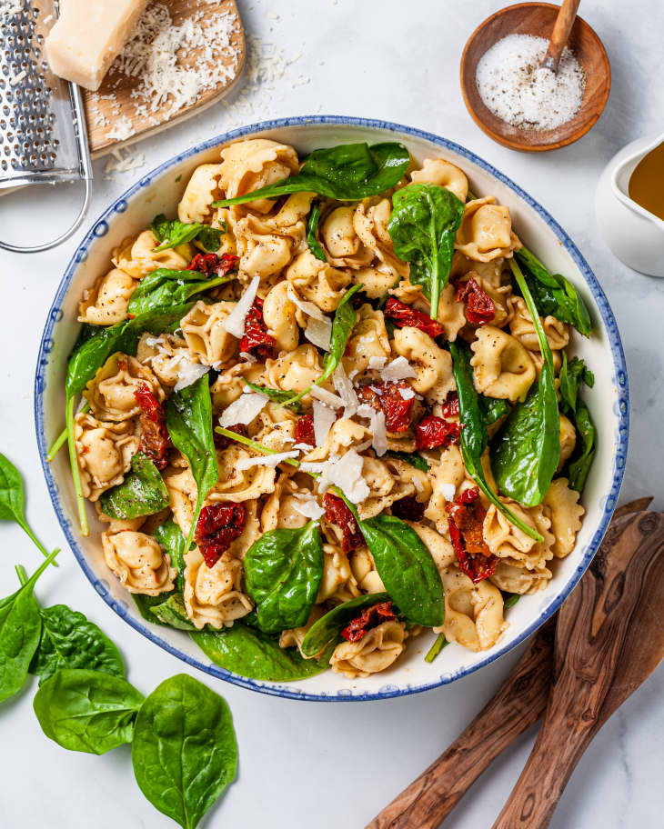Tuscan tortellini salad with spinach and sun-dried tomatoes in a bowl
