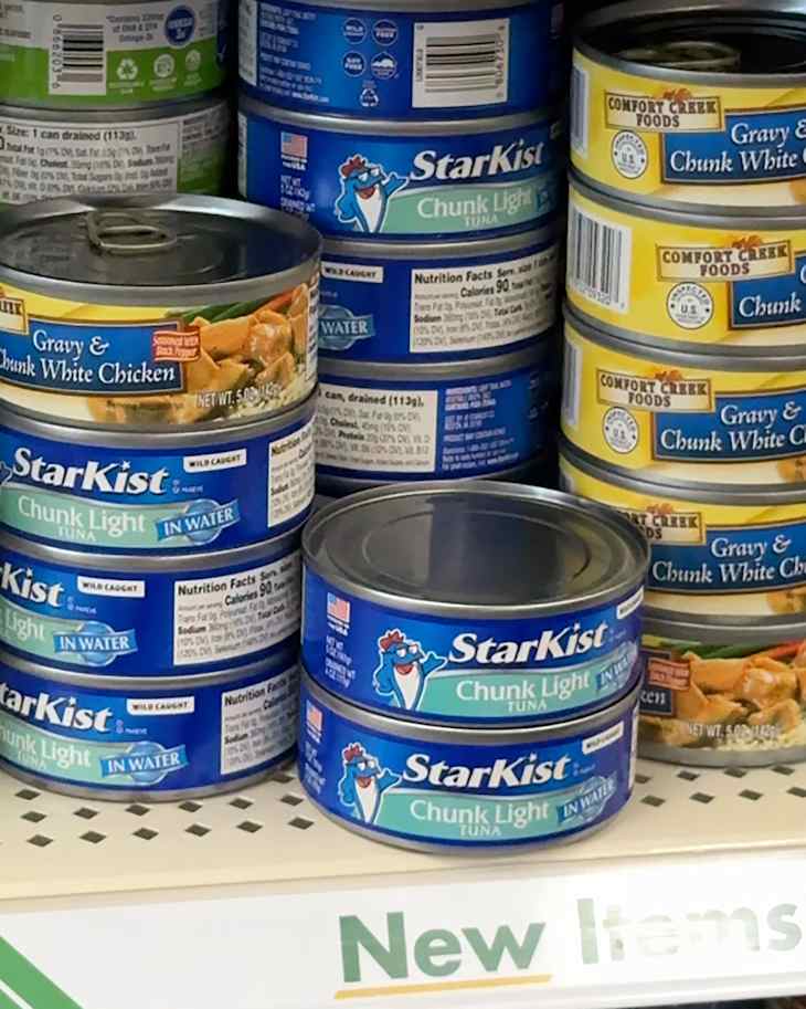 Canned tuna in aisle at Dollar Tree.
