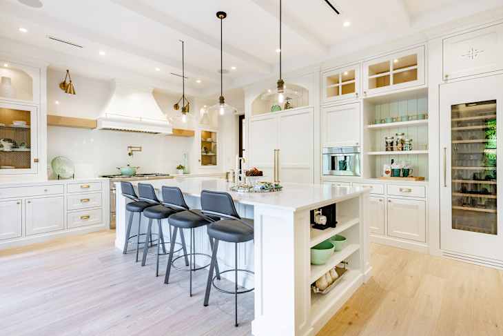 Elegant modern farmhouse interior kitchen dining with bar white marble charcoal grey chairs bar stools and decor