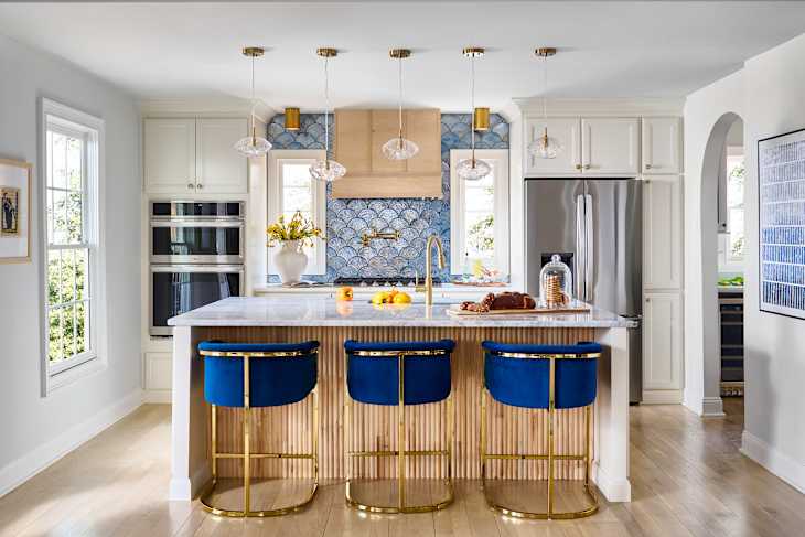 Blue and gold stools in newly renovated kitchen.