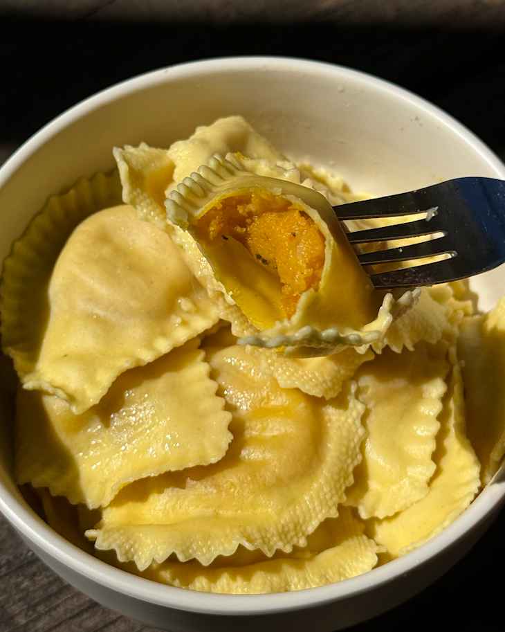 Bite taken out of Wildgrain pumpkin ravioli.