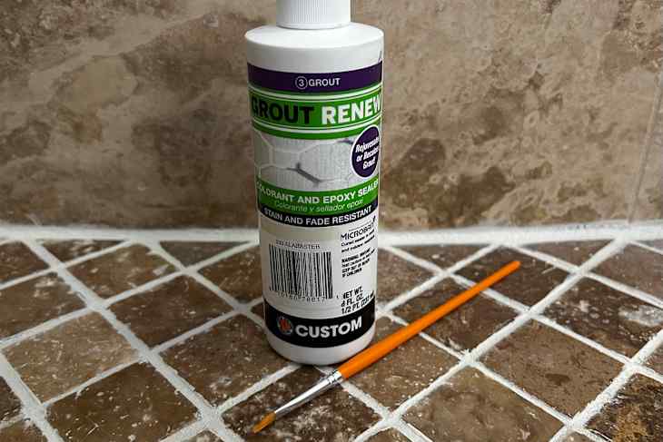 Old kitchen backsplash, grout renew colorant, and a small paintbrush