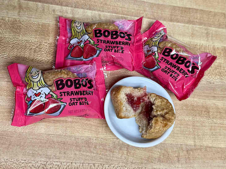 Bobo's strawberry stuffed oat bites on butcher block countertop.