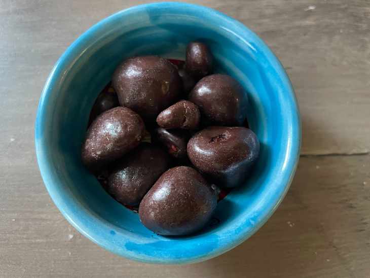 Chocolate covered tru fru raspberries in bowl.