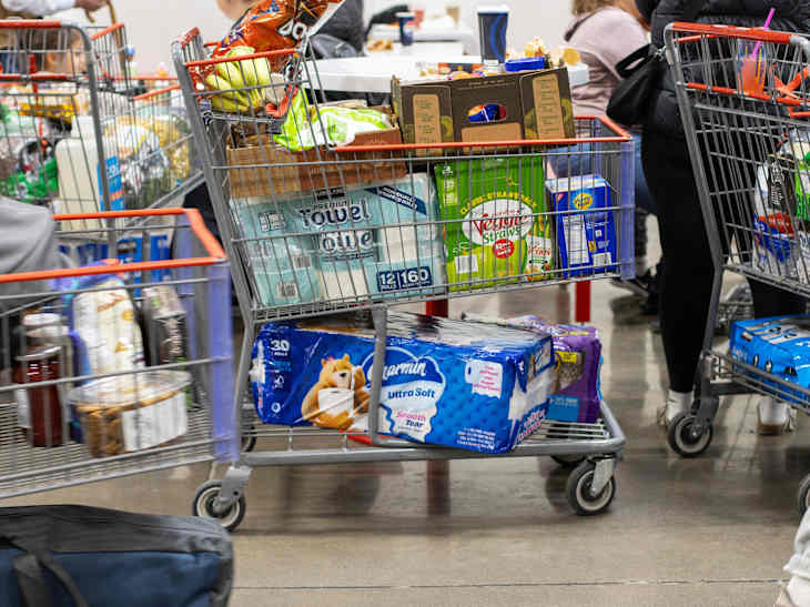 Tigard, OR, USA - May 14, 2025: Shopping carts full of groceries at a Costco store in Tigard, Oregon. Costco Wholesale Corporation operates a chain of membership-only warehouse club retail stores.