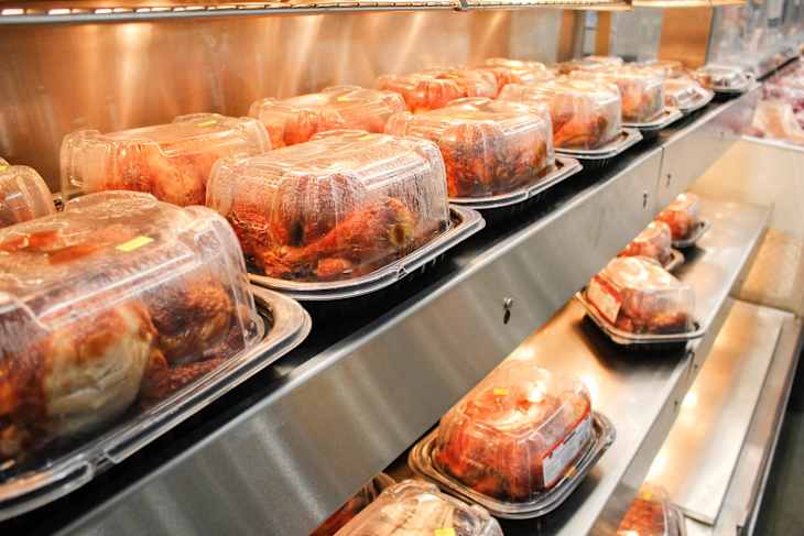 A view of the warmer shelves full of Kirkland Signature rotisserie chicken, seen at a local Costco store.