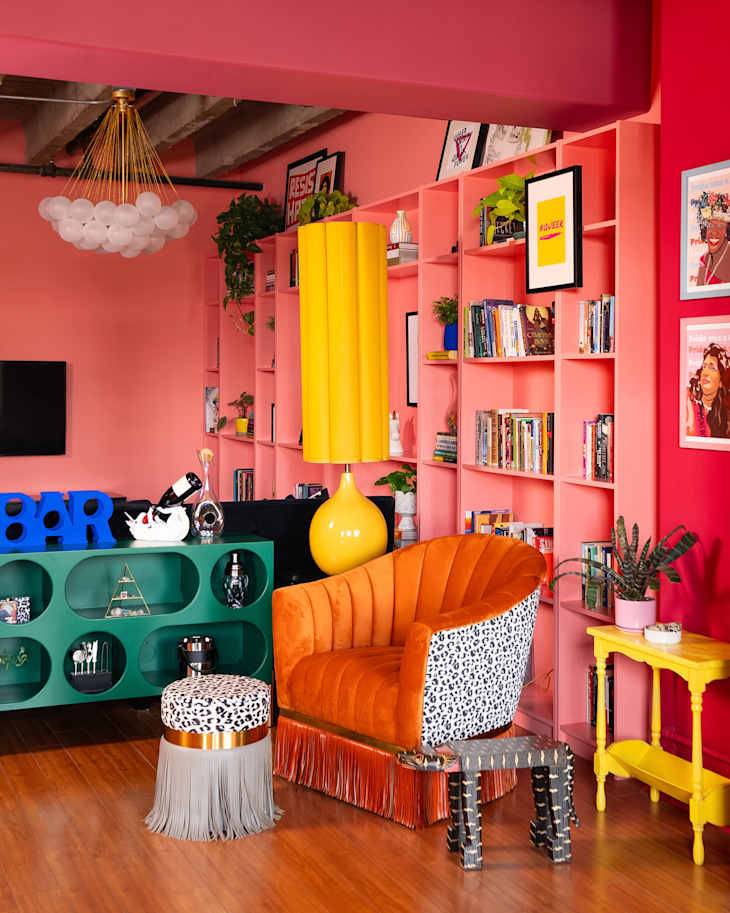 colorful living room with floor to ceiling coral shelves