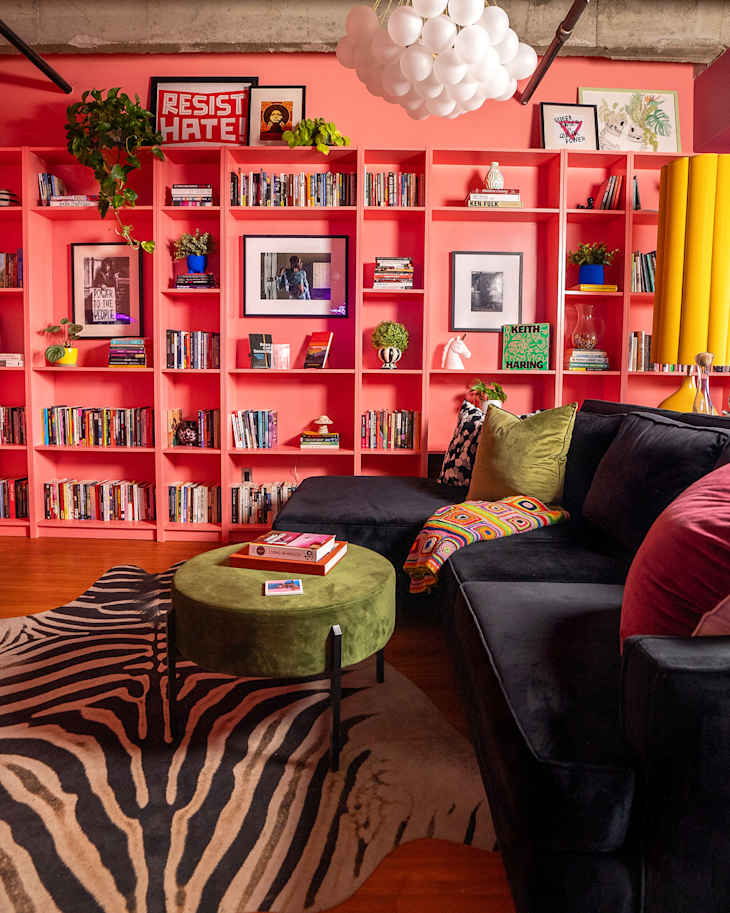 colorful living room with floor to ceiling coral shelves