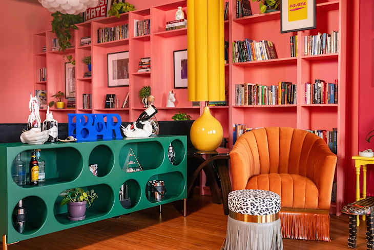 colorful living room with floor to ceiling coral shelves