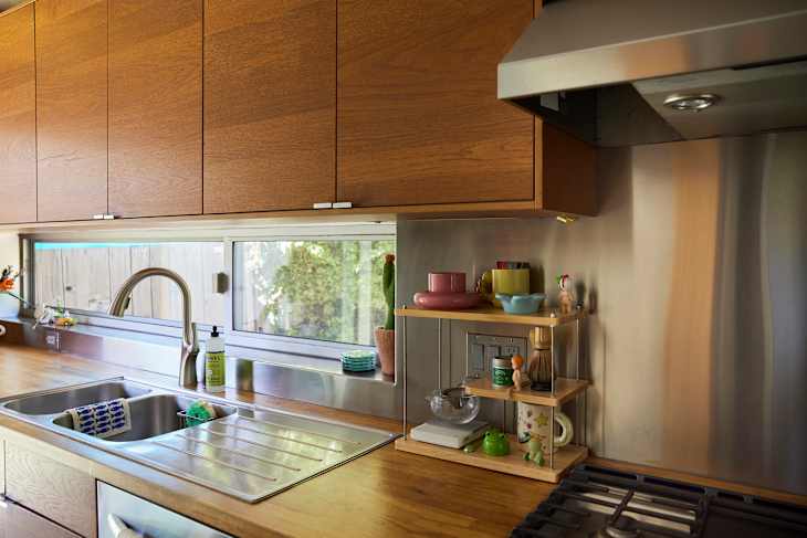 Modern kitchen with wooden cabinets, stainless steel accents